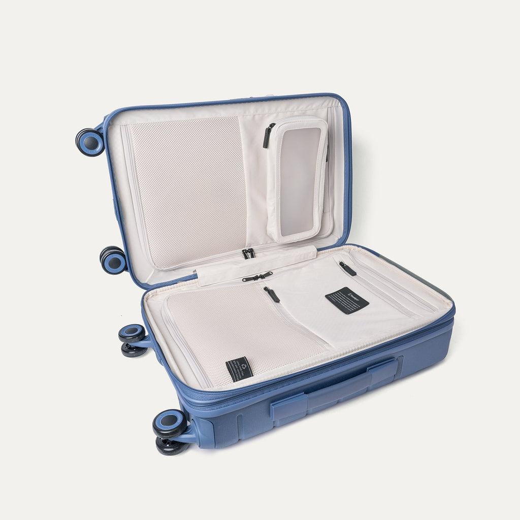 Open interior of the Compact Carry-On from the Travelpro Platinum Reserve Compact Carry-On / Medium Check-In Hardside Set in Steel Blue showing the zippered divider panel