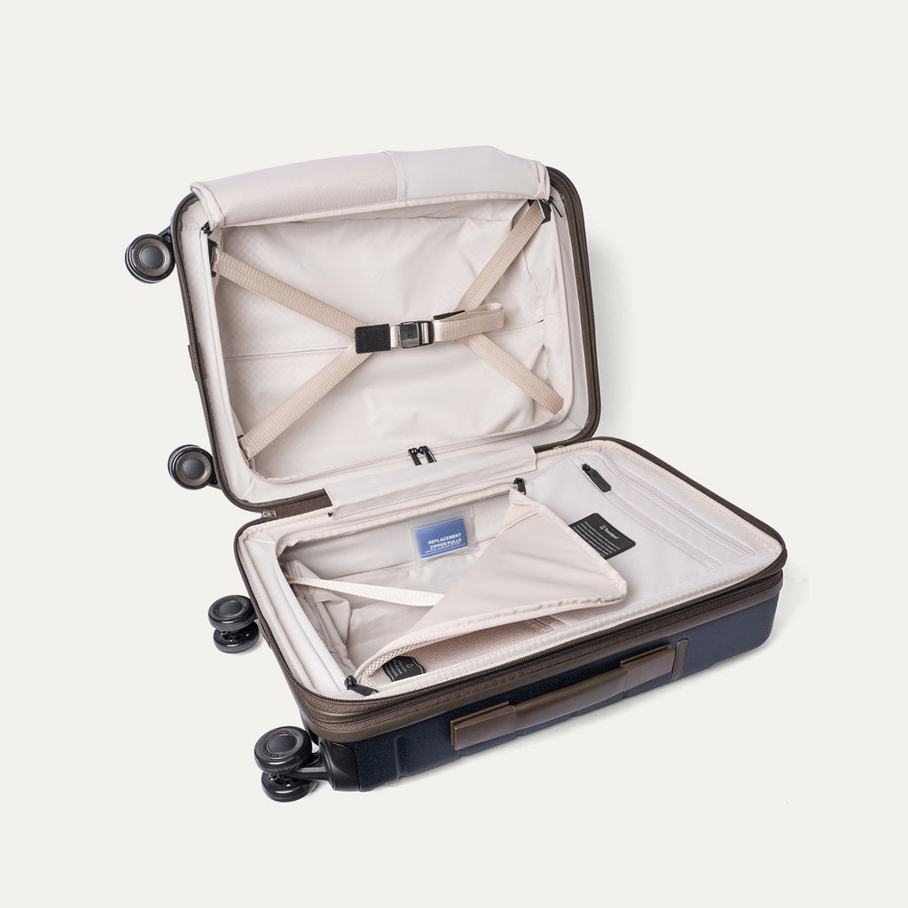 Open interior of the Compact Carry-On from the Travelpro Platinum Reserve Compact Carry-On / Large Check-In Hardside Set in Midnight Trail with hold-down straps
