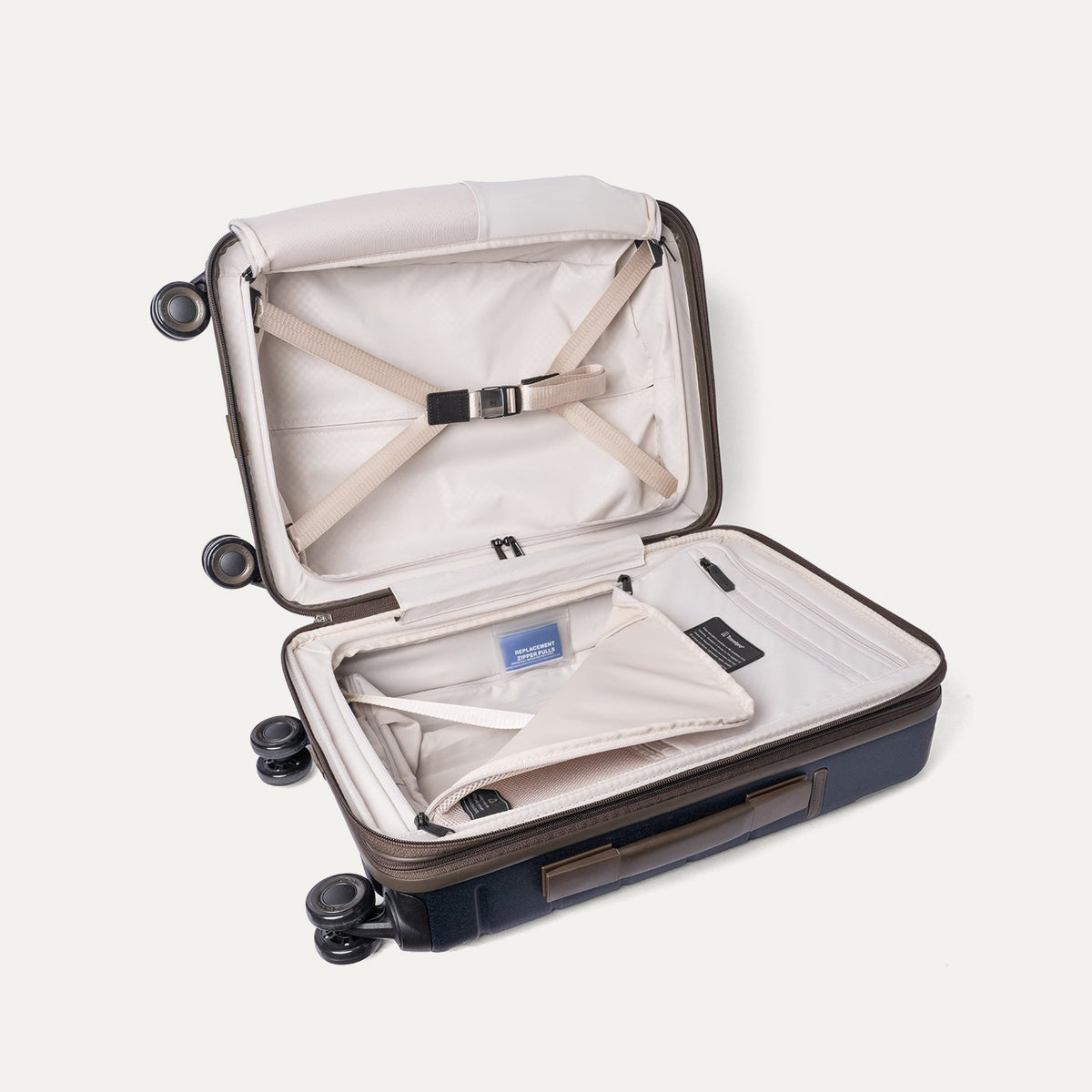Open interior of the Compact Carry-On from the Travelpro Platinum Reserve Compact Carry-On / Large Check-In Hardside Set in Midnight Trail with hold-down straps