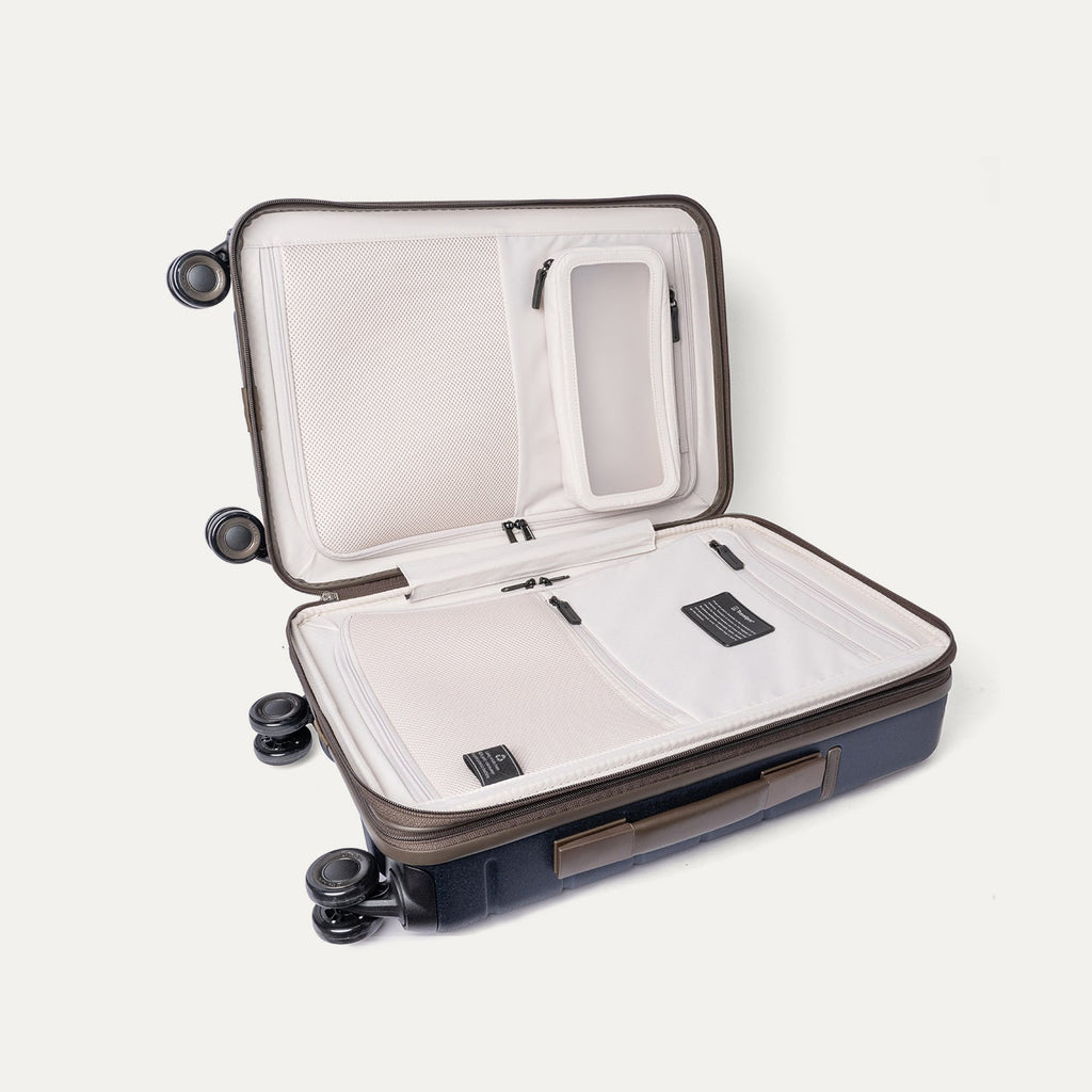 Open interior of the Compact Carry-On from the Travelpro Platinum Reserve Compact Carry-On / Medium Check-In Hardside Set in Midnight Trail showing the zippered divider panel