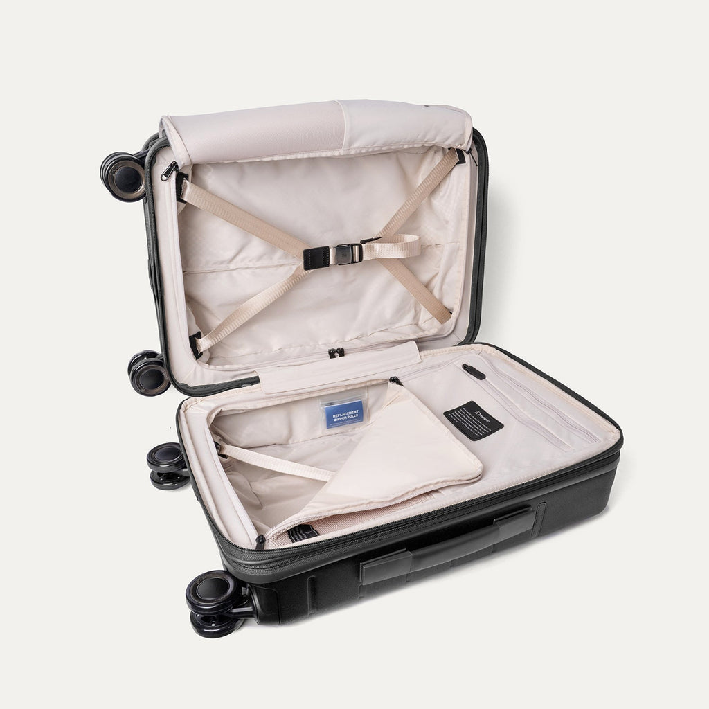 Open interior of the Compact Carry-On from the Travelpro Platinum Reserve Compact Carry-On / Medium / Large Hardside Set in Black Dust with hold-down straps