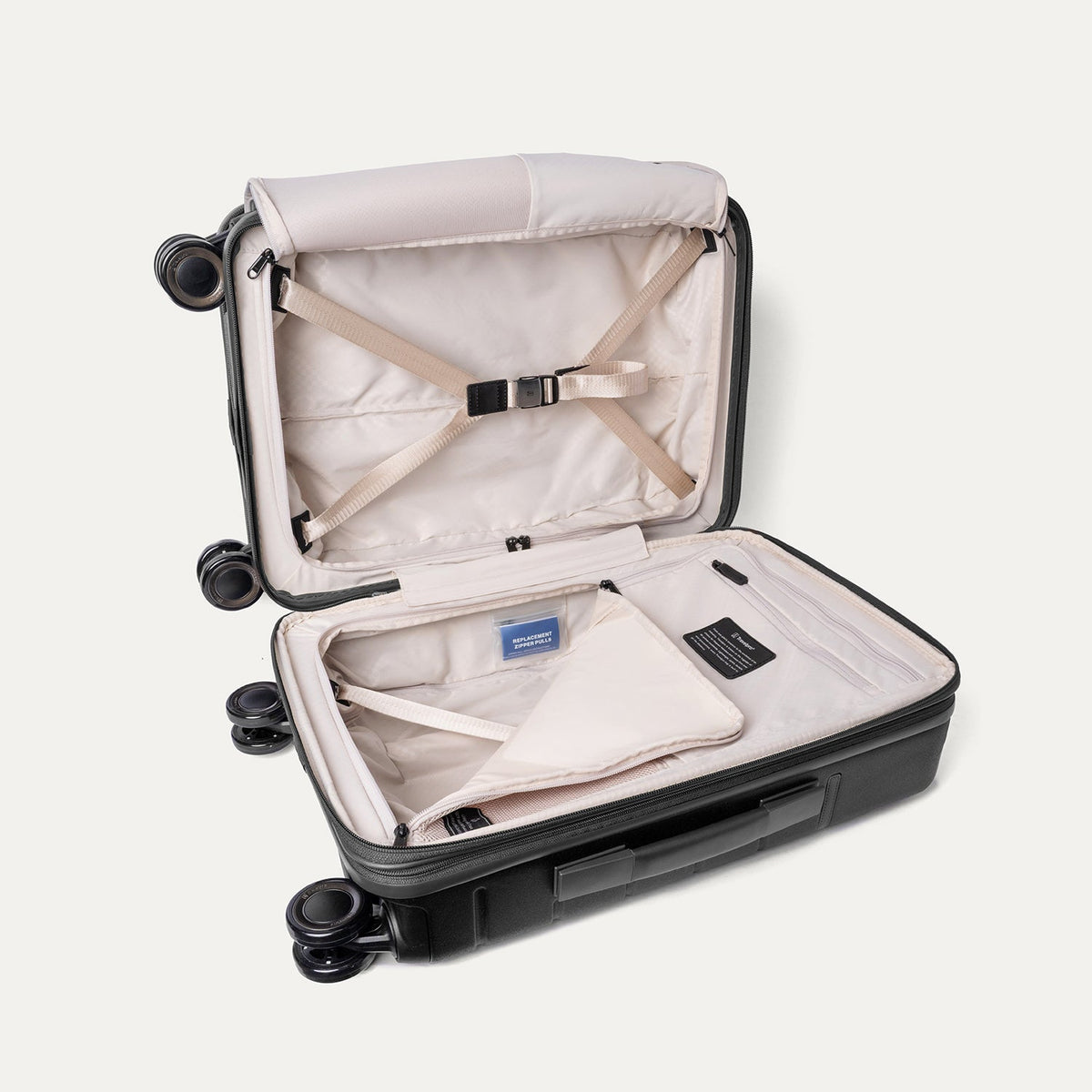 Open interior of the Compact Carry-On from the Travelpro Platinum Reserve Compact Carry-On / Medium / Large Hardside Set in Black Dust with hold-down straps