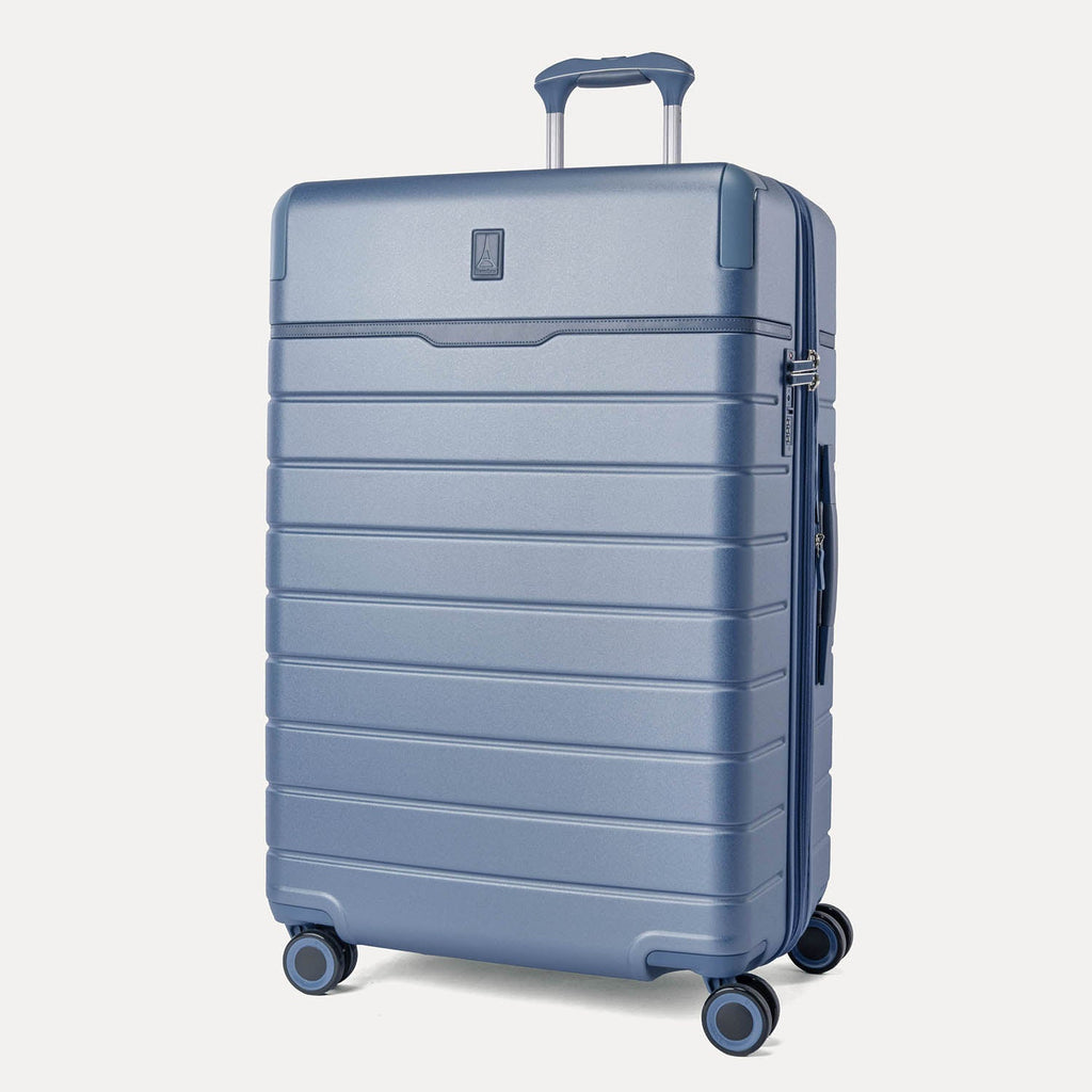 Three-quarter front view of the Large Check-In from the Travelpro Platinum Reserve Compact Carry-On / Medium / Large Hardside Set in Steel Blue