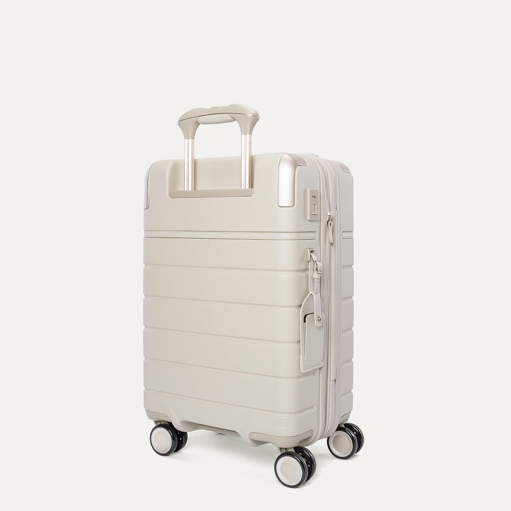 Rear angled view of the Compact Carry-On from the Travelpro Platinum Reserve Compact Carry-On / Medium / Large Hardside Set in Sandstone
