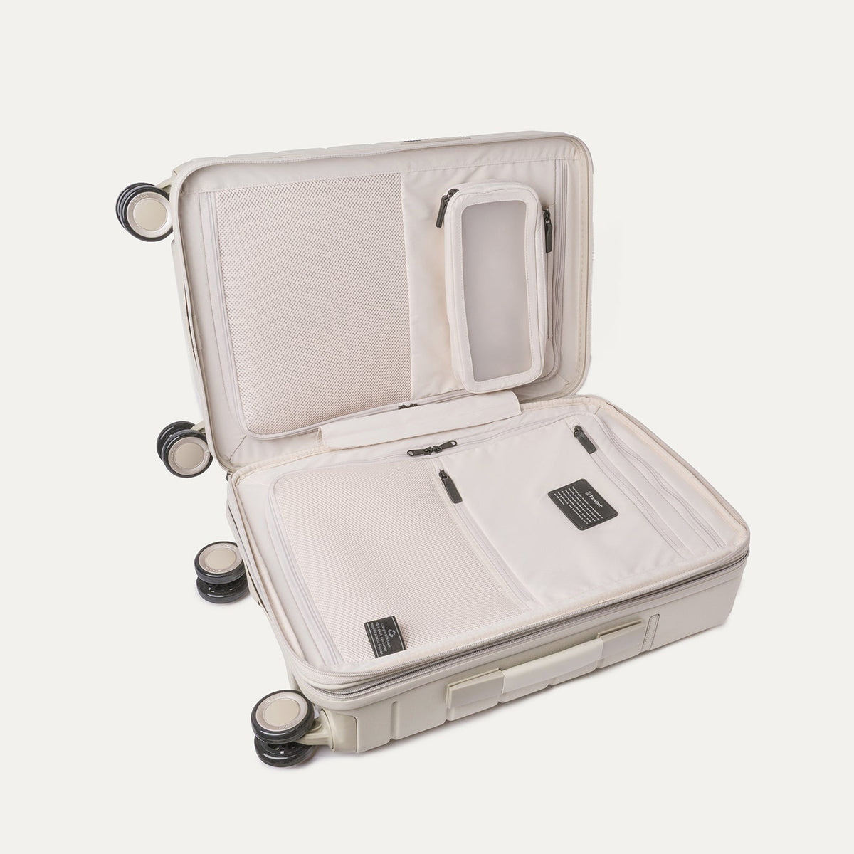 Open interior of the Compact Carry-On from the Travelpro Platinum Reserve Compact Carry-On / Medium / Large Hardside Set in Sandstone showing the zippered divider panel