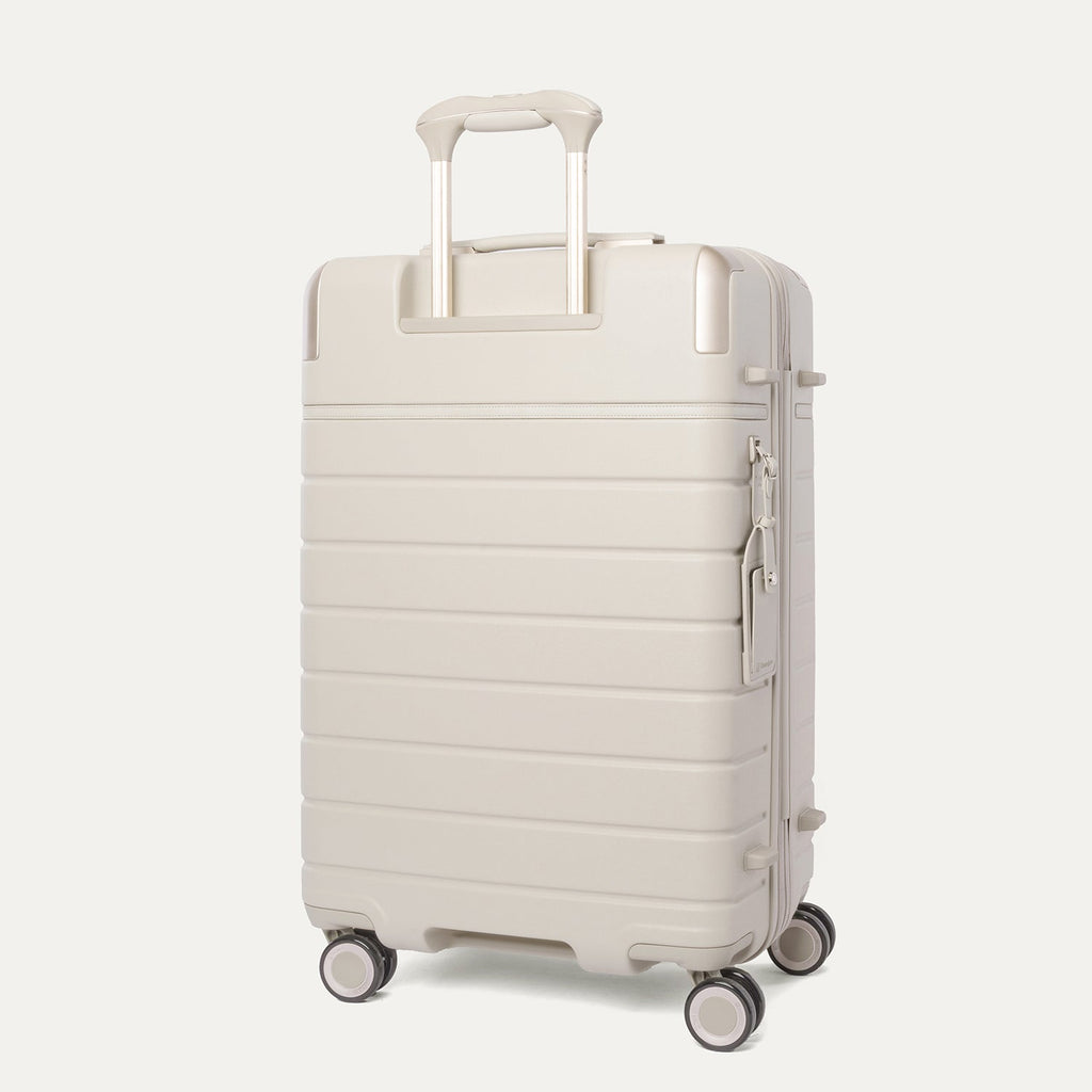 Rear angled view of the Medium Check-In from the Travelpro Platinum Reserve Compact Carry-On / Medium / Large Hardside Set in Sandstone