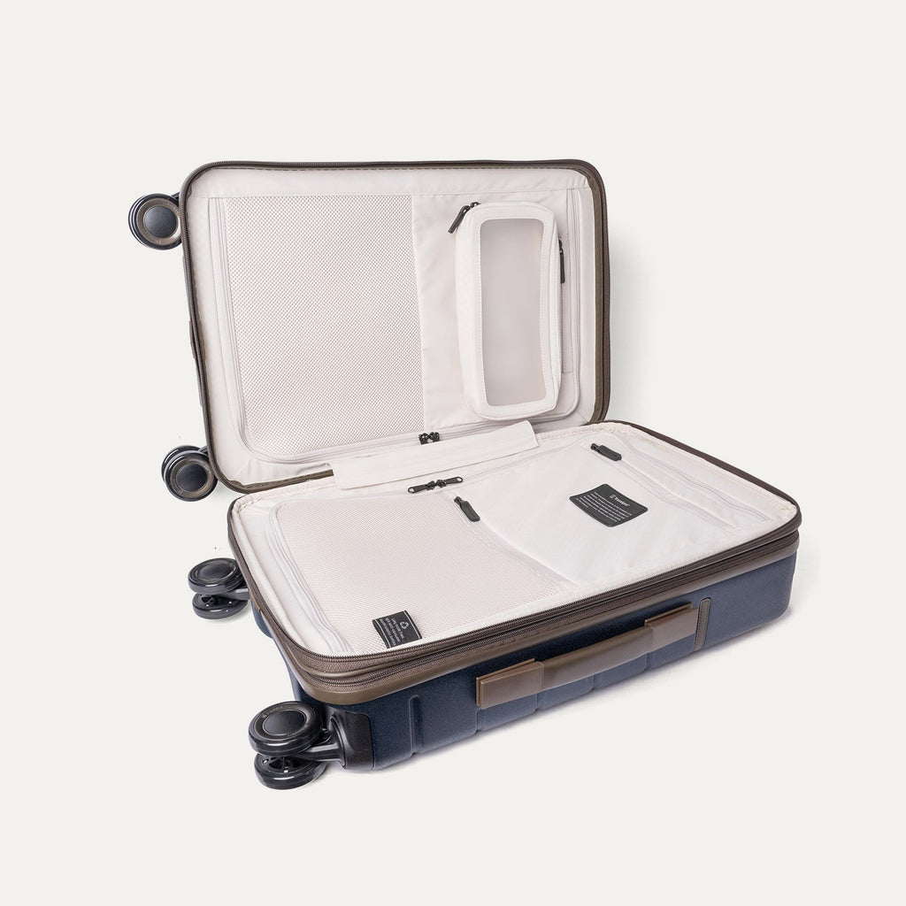 Open interior of the Compact Carry-On from the Travelpro Platinum Reserve Compact Carry-On / Medium / Large Hardside Set in Midnight Trail showing the zippered divider panel