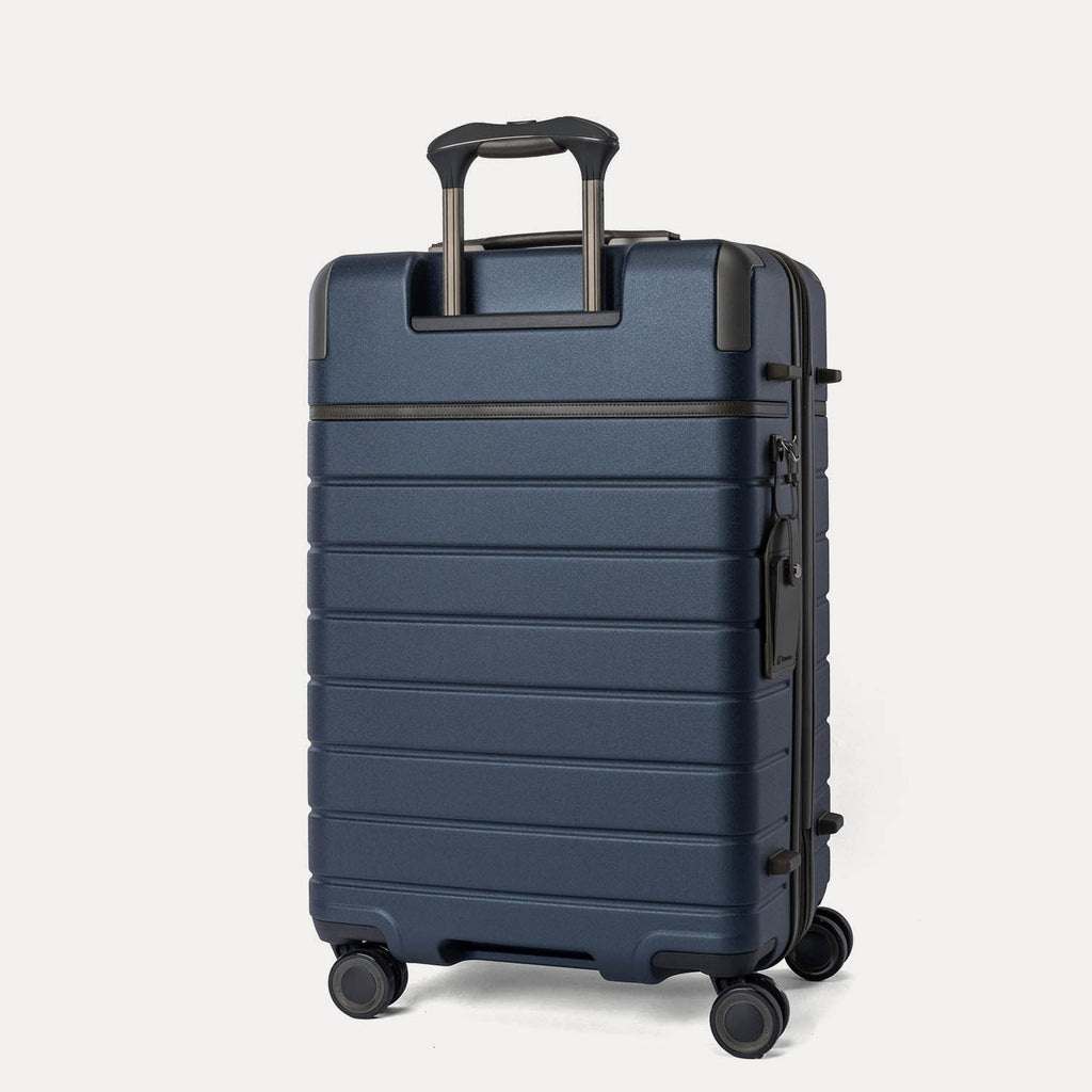 Rear angled view of the Medium Check-In from the Travelpro Platinum Reserve Compact Carry-On / Medium / Large Hardside Set in Midnight Trail
