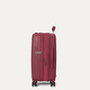 Red suitcase on a light gray background