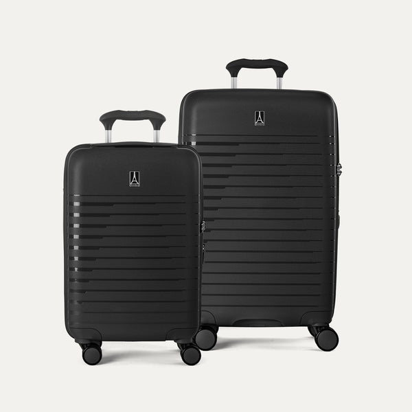 Two black suitcases with handles and wheels on a light gray background
