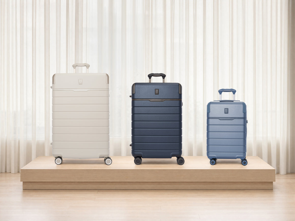 Platinum Reserve Large Check-In in Sandstone, Medium Check-In in Midnight Trail and Compact Carry-On in Steel Blue
